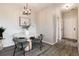 Dining area with a modern table, chairs, and stylish lighting at 7408 S Alkire St # 301, Littleton, CO 80127