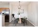 Cozy dining area with modern table and chairs, stainless steel refrigerator at 7408 S Alkire St # 301, Littleton, CO 80127