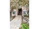 Exterior of building with flowering trees and stairway at 7408 S Alkire St # 301, Littleton, CO 80127