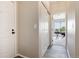 Hallway featuring closet and doorway to a bright room at 7408 S Alkire St # 301, Littleton, CO 80127