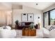 Open concept living room with modern decor and balcony access at 7408 S Alkire St # 301, Littleton, CO 80127