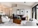 Well-lit living room with modern furnishings and balcony access at 7408 S Alkire St # 301, Littleton, CO 80127