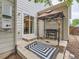 Outdoor barbecue area featuring a grill, patio cover, and decorated with floral accents at 8010 Raspberry Dr, Frederick, CO 80504