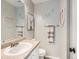 Well-lit bathroom features a vanity with sink, stylish decor, and a clean, modern aesthetic at 8010 Raspberry Dr, Frederick, CO 80504
