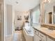 Bright bathroom featuring double sinks, soaking tub, and tile floors, offering a relaxing and functional space at 8010 Raspberry Dr, Frederick, CO 80504