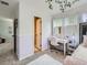 Serene bedroom with a work area and bright window, complemented by calming colors and decor at 8010 Raspberry Dr, Frederick, CO 80504