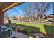 Charming front yard featuring a well-maintained lawn, trees, and a view of the neighborhood at 201 S Lafayette St, Denver, CO 80209