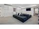 Spacious living room with built-in shelving and a large comfortable sectional at 201 S Lafayette St, Denver, CO 80209