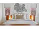 Close-up of a beautifully styled main bedroom featuring a unique headboard and plush pillows for a cozy retreat at 201 S Lafayette St, Denver, CO 80209