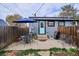 Cozy backyard patio area with seating, umbrella, and grill, perfect for outdoor entertaining at 3130 N Race St, Denver, CO 80205