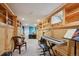 Finished basement with built-in bookshelves and a music area featuring a keyboard at 3130 N Race St, Denver, CO 80205