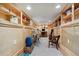 Finished basement with built-in bookshelves and a music area featuring a keyboard and desk at 3130 N Race St, Denver, CO 80205