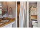 Bathroom featuring a single sink vanity with stone countertop and a shower with curtain at 3130 N Race St, Denver, CO 80205