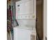 Efficient laundry area with stacked washer and dryer maximizing space at 3130 N Race St, Denver, CO 80205