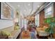 Spacious living room open to dining and kitchen with hardwood floors and exposed brick at 3130 N Race St, Denver, CO 80205