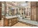 Unique bathroom with mirrored walls and ceiling paired with tile and wood vanity at 2501 S Gray Ct, Lakewood, CO 80227