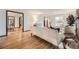 Bright living room featuring hardwood floors and a view into the dining area at 2501 S Gray Ct, Lakewood, CO 80227