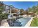 Backyard oasis with a sparkling pool, relaxing spa, and multiple seating areas, perfect for entertaining at 6017 Merchant Pl, Parker, CO 80134
