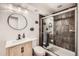 Modern bathroom with a glass-enclosed shower, stylish vanity, and updated fixtures at 6017 Merchant Pl, Parker, CO 80134