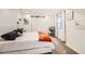 Bright bedroom with white walls, sliding barn doors, and a comfortable, neutral decor at 6017 Merchant Pl, Parker, CO 80134