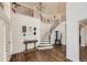 Grand entry with curved staircase, hardwood floors, and decorative accents at 6017 Merchant Pl, Parker, CO 80134