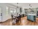 Bright kitchen nook with a charming table and chairs, adjacent to kitchen at 6017 Merchant Pl, Parker, CO 80134
