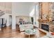 Open living area with a view into the dining room and fireplace at 6017 Merchant Pl, Parker, CO 80134