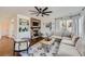 Spacious living room with stone fireplace and comfy sectional sofa at 6017 Merchant Pl, Parker, CO 80134