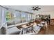 Open living room with views into the kitchen and hardwood floors at 6017 Merchant Pl, Parker, CO 80134