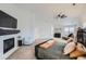 A full view of the main bedroom which includes a fireplace, large windows, and a comfortable seating area at 6017 Merchant Pl, Parker, CO 80134