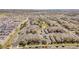 Aerial view of a dense residential neighborhood with orderly rows of townhomes and ample parking at 5765 N Genoa Way # 1-103, Aurora, CO 80019