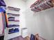 Well-organized walk-in closet featuring wire shelving units, providing ample storage space for clothing and accessories at 5765 N Genoa Way # 1-103, Aurora, CO 80019