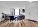 Bright living room with hardwood floors, comfortable seating, and a fireplace at 5765 N Genoa Way # 1-103, Aurora, CO 80019