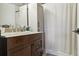 Well-appointed bathroom featuring a granite vanity, modern fixtures, and a shower with a curtain at 8220 W 90Th Pl # 2003, Broomfield, CO 80021