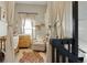 Bright Bedroom featuring a crib, changing table, comfortable armchair, and playful tiger rug at 8220 W 90Th Pl # 2003, Broomfield, CO 80021