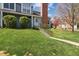 Attractive townhouse showcasing a lush green lawn, mature trees, and charming curb appeal at 8220 W 90Th Pl # 2003, Broomfield, CO 80021