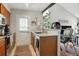 Well-lit kitchen featuring wood cabinets, stainless steel appliances, and easy access to the living area at 8220 W 90Th Pl # 2003, Broomfield, CO 80021