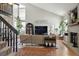 Inviting living room with vaulted ceilings, a fireplace, and lots of natural light from large windows at 8220 W 90Th Pl # 2003, Broomfield, CO 80021