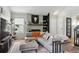 Bright living room featuring contemporary furnishings, fireplace, and large window for natural light at 8220 W 90Th Pl # 2003, Broomfield, CO 80021