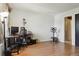 Versatile room setup as home office and gym with wood laminate floors and natural light at 8220 W 90Th Pl # 2003, Broomfield, CO 80021