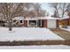 Brick ranch home with a snow-covered lawn and attached garage at 2250 Grape Ave, Boulder, CO 80304