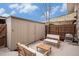Well-maintained backyard shed and seating area for outdoor enjoyment at 3981 S Boston St, Denver, CO 80237