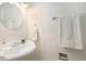 Bathroom features an elegant sink and vanity with mirror and fresh white towels at 3981 S Boston St, Denver, CO 80237