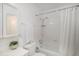 Bathroom with a bathtub and shower combination, toilet, vanity and towel rack at 3981 S Boston St, Denver, CO 80237