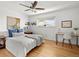 Inviting bedroom with hardwood floors, ceiling fan and bright natural light at 3981 S Boston St, Denver, CO 80237