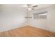 An empty bedroom features gleaming hardwood floors and a bright window at 3981 S Boston St, Denver, CO 80237