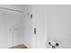 Bright entryway featuring a clean white door and built-in storage on the left at 3981 S Boston St, Denver, CO 80237