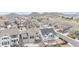 An aerial view features an established neighborhood with diverse architecture and a scenic mountain backdrop in Castle Rock, Colorado at 1445 Colebrook Ct, Castle Rock, CO 80109