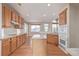 Traditional kitchen features oak cabinets, center island, and a breakfast nook with large windows for natural light at 1445 Colebrook Ct, Castle Rock, CO 80109