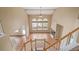 Upstairs view into the spacious living room below, featuring tall ceilings, hardwood floors, and a fireplace at 1445 Colebrook Ct, Castle Rock, CO 80109